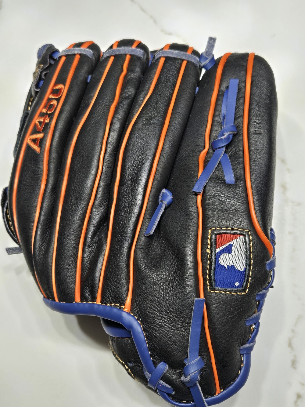 Wilson Black Baseball Glove with Orange Piping and Blue Laces